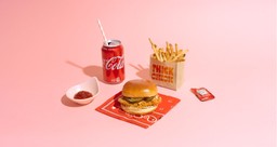 Image of Chicken Sandwich, Fries, and a Coca Cola on a Pink Background