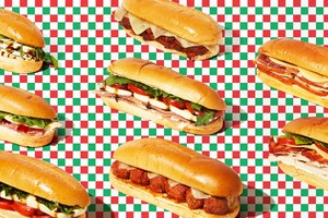 Hot italian sub sandwiches on a checkered green, white and red background
