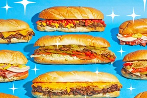 Sub sandwiches with meat, cheese and vegetables on blue twinkly background